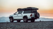 Load image into Gallery viewer, Alu-Cab Explorer Canopy - Hilux Revo 2016+ DC Black Smooth
